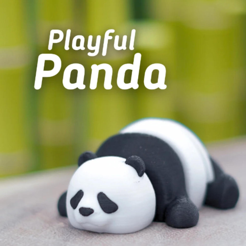 A 3D-printed panda figurine in a relaxed pose, with a white head and body, and black markings. The text "Playful Panda" is displayed in white above the panda. The background is a blurred green.