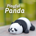 A 3D-printed panda figurine in a relaxed pose, with a white head and body, and black markings. The text "Playful Panda" is displayed in white above the panda. The background is a blurred green.